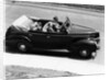 1930s 1940s Couple Driving 1938 Convertible Four Door Sedan Automobile With Luggage In Back Seat by Anonymous