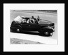 1930s 1940s Couple Driving 1938 Convertible Four Door Sedan Automobile With Luggage In Back Seat by Anonymous