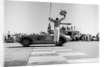 1960s Man Jumping Waving Checkered Flag As Winning Sports Car Crossing The Finish Line by Anonymous