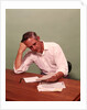 1970s Middle Age Man Sitting At Desk Worried About Bills To Pay by Anonymous
