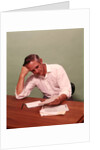 1970s Middle Age Man Sitting At Desk Worried About Bills To Pay by Anonymous