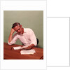 1970s Middle Age Man Sitting At Desk Worried About Bills To Pay by Anonymous