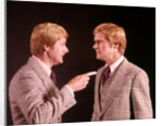 1970s Angry Red Haired Man In Plaid Suit Arguing With Himself by Anonymous