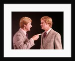 1970s Angry Red Haired Man In Plaid Suit Arguing With Himself by Anonymous