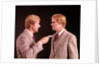 1970s Angry Red Haired Man In Plaid Suit Arguing With Himself by Anonymous
