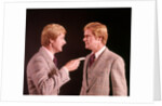 1970s Angry Red Haired Man In Plaid Suit Arguing With Himself by Anonymous