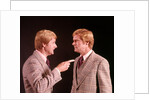 1970s Angry Red Haired Man In Plaid Suit Arguing With Himself by Anonymous