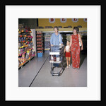 1970s Two Women Small Girl Walking Down Supermarket Grocery Store Aisle Woman Pushing Cart by Anonymous