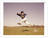 1960s Jumping Running Man Football Player by Anonymous