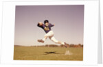 1960s Jumping Running Man Football Player by Anonymous