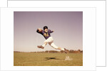 1960s Jumping Running Man Football Player by Anonymous