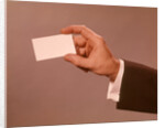 1960s 1970s Man Hand Holding Blank Business Card by Anonymous