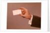 1960s 1970s Man Hand Holding Blank Business Card by Anonymous