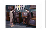 1960s Couple Man Woman Talking To Salesman In Color Television Set Sales Department by Anonymous