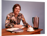 1970s Young Man Mustache Loud Print Shirt Desk Empty Coffee Cup Pot Family Budget by Anonymous