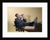 1960s Successful Businessman With Look Of Satisfaction Sitting With Shoes Propped On Desk by Anonymous