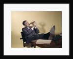 1960s Successful Businessman With Look Of Satisfaction Sitting With Shoes Propped On Desk by Anonymous