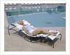 1960s Elegant Tall Woman In Bathing Suit Reclining On A Lounge Chair By Swimming Pool by Anonymous