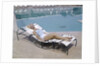 1960s Elegant Tall Woman In Bathing Suit Reclining On A Lounge Chair By Swimming Pool by Anonymous