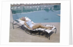 1960s Elegant Tall Woman In Bathing Suit Reclining On A Lounge Chair By Swimming Pool by Anonymous