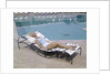 1960s Elegant Tall Woman In Bathing Suit Reclining On A Lounge Chair By Swimming Pool by Anonymous