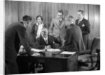 1930s Worried Business Group In Office Meeting Around The Boss' Desk by Anonymous