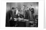 1930s Worried Business Group In Office Meeting Around The Boss' Desk by Anonymous