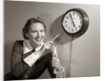 1950s Woman Holding Steno Pad Pointing With Pencil To Clock 5 Minutes Till Quitting Time by Anonymous