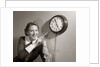 1950s Woman Holding Steno Pad Pointing With Pencil To Clock 5 Minutes Till Quitting Time by Anonymous