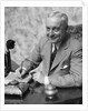 1920s 1930s Man Businessman,Salesman Sitting At Desk Smoking Cigar Writing A Memo by Anonymous