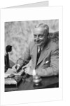 1920s 1930s Man Businessman,Salesman Sitting At Desk Smoking Cigar Writing A Memo by Anonymous