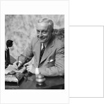 1920s 1930s Man Businessman,Salesman Sitting At Desk Smoking Cigar Writing A Memo by Anonymous