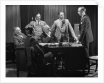 1930s Five Older Businessmen Meeting Around A Desk Listening To A Sixth Younger Man Speak by Anonymous