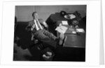 1950s Man Businessman Salesman Eating Lunch In Office With Feet Resting Up On Desk by Anonymous