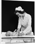 1940s Woman Nurse Changing Baby Diaper In Nursery by Anonymous