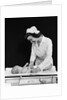 1940s Woman Nurse Changing Baby Diaper In Nursery by Anonymous