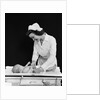 1940s Woman Nurse Changing Baby Diaper In Nursery by Anonymous