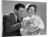 1950s 1960s Man New Father Looking At Baby Held By Woman Nurse by Anonymous