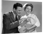 1950s 1960s Man New Father Looking At Baby Held By Woman Nurse by Anonymous