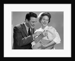 1950s 1960s Man New Father Looking At Baby Held By Woman Nurse by Anonymous
