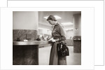 1950s 1960s Woman Handbag On Arm Gloves Filling Out Deposit Slip Bank Counter by Anonymous