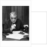 1930s Head-On Serious Senior Businessman Behind Desk Hand On Telephone Pointing by Anonymous