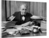 1920s 1930s Elderly Executive Man Sitting At Desk Looking Through Papers by Anonymous