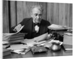 1920s 1930s Elderly Executive Man Sitting At Desk Looking Through Papers by Anonymous