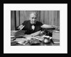 1920s 1930s Elderly Executive Man Sitting At Desk Looking Through Papers by Anonymous