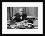 1920s 1930s Elderly Executive Man Sitting At Desk Looking Through Papers by Anonymous