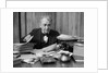 1920s 1930s Elderly Executive Man Sitting At Desk Looking Through Papers by Anonymous