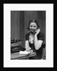 1930s Woman Receptionist Secretary Sitting At Desk In Office Talking On Telephone by Anonymous
