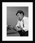 1960s Reporter With Hat On Phone At Typewriter by Anonymous