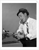 1960s Reporter With Hat On Phone At Typewriter by Anonymous